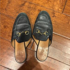 Gucci Black Leather Mules with Gold Accents